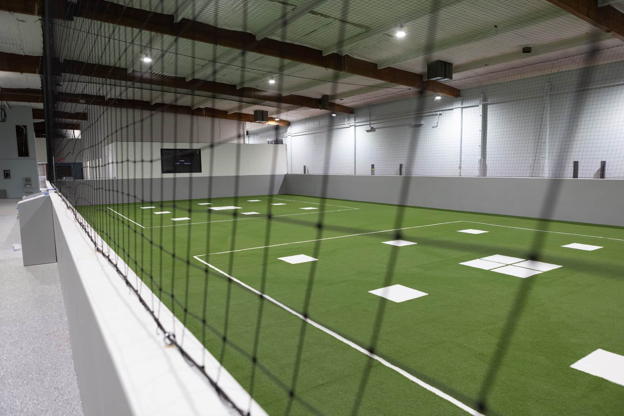 Athletes in a coached field session on match-grade indoor turf at Formula Soccer Center.